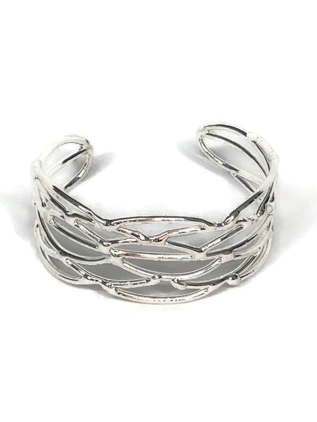 bracelet en laiton argenté, entrelacs de petites mailles sur environ 3 cm de large, vue de face