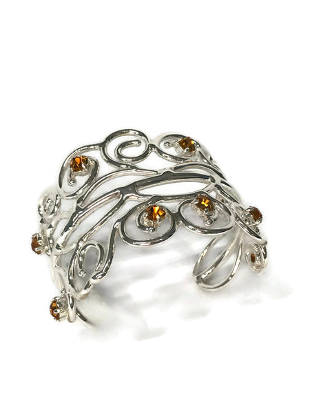 bracelet manchette de créateur style princesse, en laiton argenté, 9 strass ambre ou jais ou aigue-marine ou péridot, vue de dessus