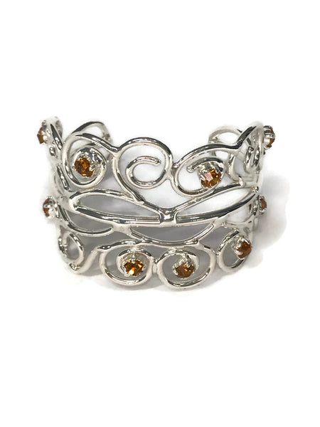 bracelet manchette de créateur style princesse, en laiton argenté, 9 strass ambre ou jais ou aigue-marine ou péridot, vue de face