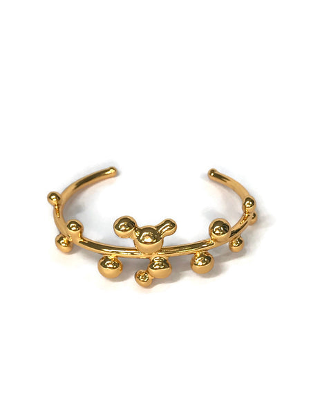 bracelet jonc orné de petites boules de métal fondu sur le pourtour, doré, vue de face