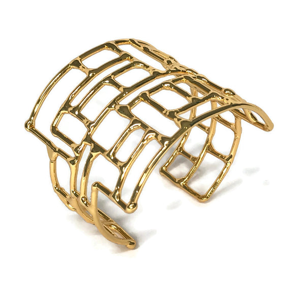 bracelet en laiton doré, composé de rectangles et de carrés irréguliers, tels un labyrinthe, vue de dessus