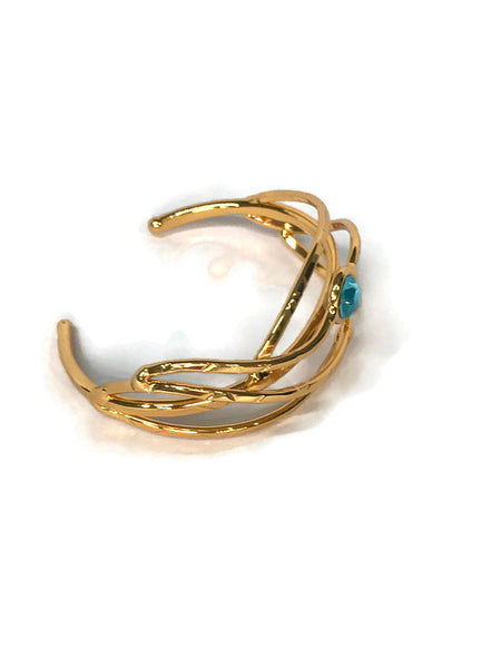 bracelet en laiton doré, mailles larges et allongées, avec 1 strass topaze bleu rond, vue de biais